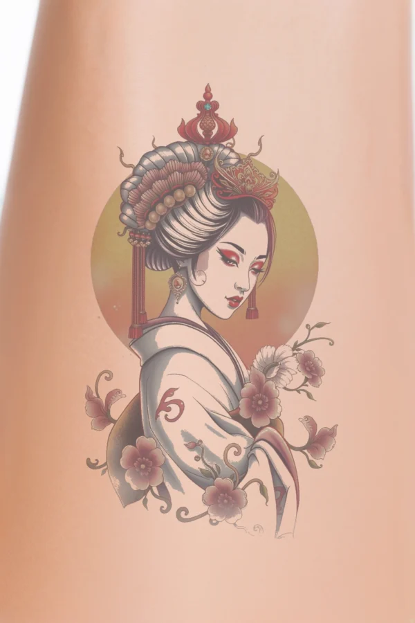 Close-up of a person's calf temporary tattoo featuring a serene woman in a traditional Japanese geisha outfit. She has an ornate red and gold headpiece, an intricately patterned white kimono, and styled hair in an updo with red lipstick. The design