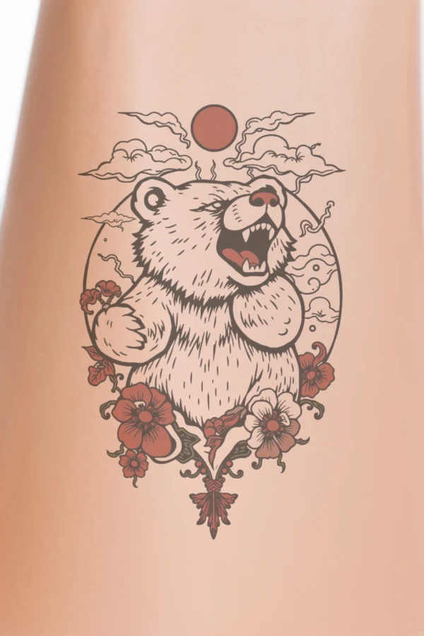 Close-up view of a person's calf featuring a temporary temporary tattoo of a polar bear's head and neck. The bear, shown in a powerful roar, is illustrated in striking black and white, with fur details in varying shades. Its eyes are a vivid red