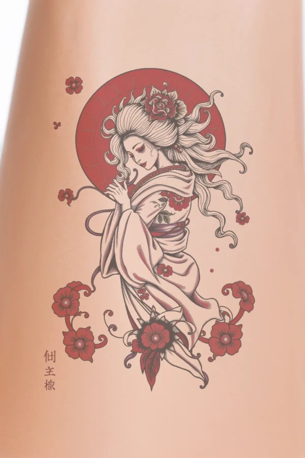 Close-up of a person's calf featuring a temporary temporary tattoo of a stylized female figure inspired by Japanese art. The serene figure, dressed in a white kimono with a red sash, has hair styled in a loose updo adorned with flowers. She is