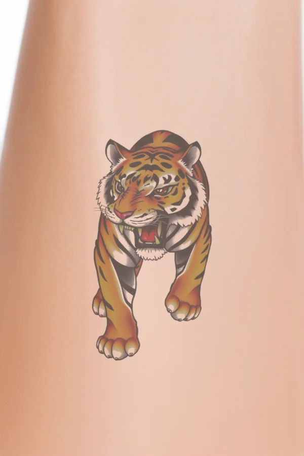 A temporary temporary tattoo design featuring a roaring tiger in a dynamic pose, facing left with its head turned towards the viewer. The tiger displays vibrant orange and black fur with distinct white stripes on its face. Its mouth is open, showcasing bared teeth, and