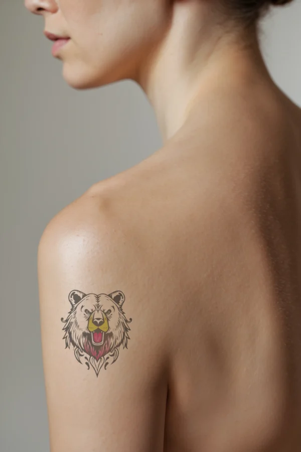 Image of a temporary temporary tattoo featuring a detailed illustration of a bear's head on a person's shoulder. The bear, depicted in striking black and white, has its mouth open in a roar, revealing a pink tongue. Its intense eyes and textured fur, with