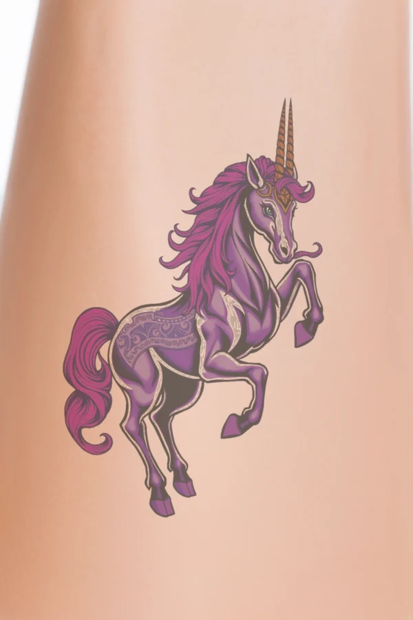 A vivid temporary temporary tattoo features a majestic unicorn with a rich purple body and light purple head. Its vibrant purple mane and tail, accented in striking pink, flow gracefully, while its bold orange horn and orange eyes stand out. The unicorn is depicted in an