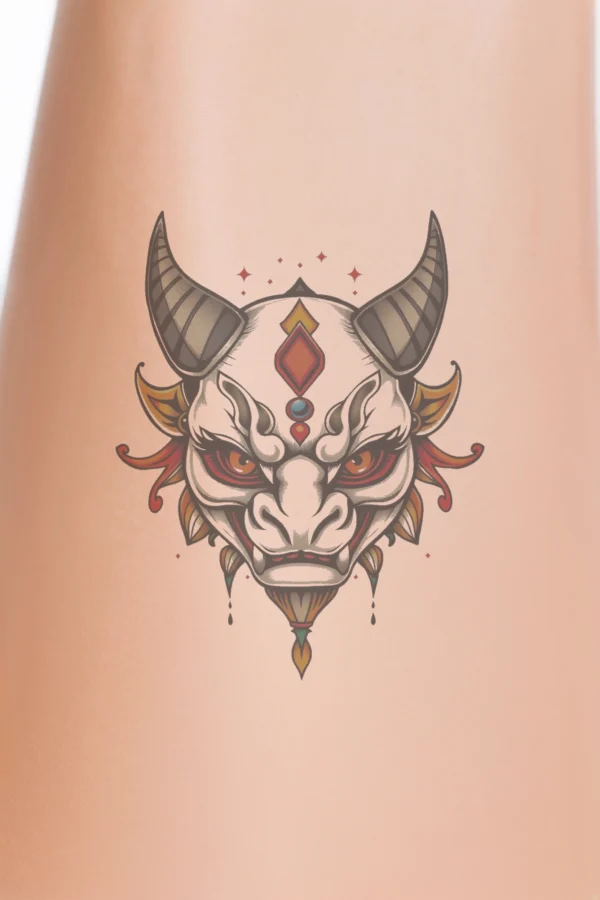 A striking temporary temporary tattoo featuring a dragon's head, illustrated in vibrant white and orange hues. The dragon boasts prominent horns on either side and piercing orange eyes, with a menacing red mouth. Intricate red and orange designs, including a gemstone ornament near