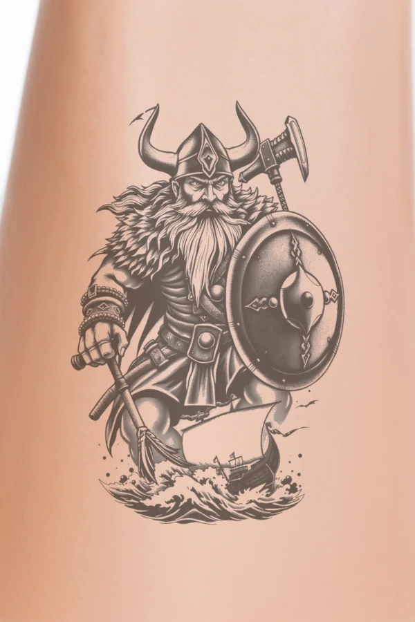 Temporary temporary tattoo design featuring a black and white image of a Viking warrior with a beard and mustache. He wears a horned helmet, a tunic with a hood, and a belt, holding a spear in his right hand and a shield in his