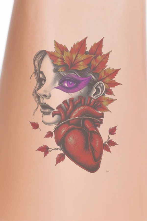 A temporary temporary tattoo design featuring a serene portrait of a woman with closed eyes and loose, wavy hair. Her lips are painted a striking red, complementing a large, intricately detailed red heart adorned with veins at the center of her face. Surround