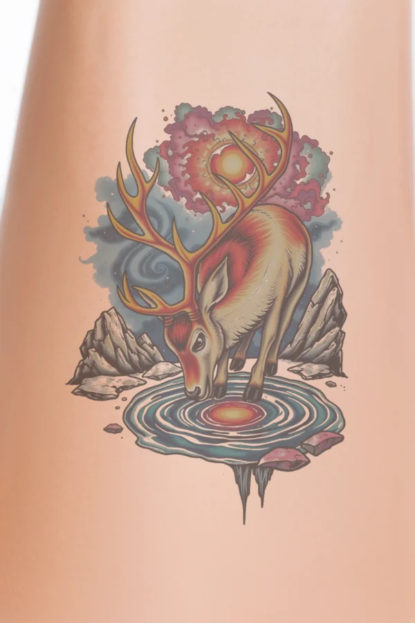 Temporary temporary tattoo design featuring a reindeer with large, curved horns standing on a dark rock. The reindeer's body is white with accents of orange and red, while its legs are dark brown or black. It faces right in front of a vibrant explosion