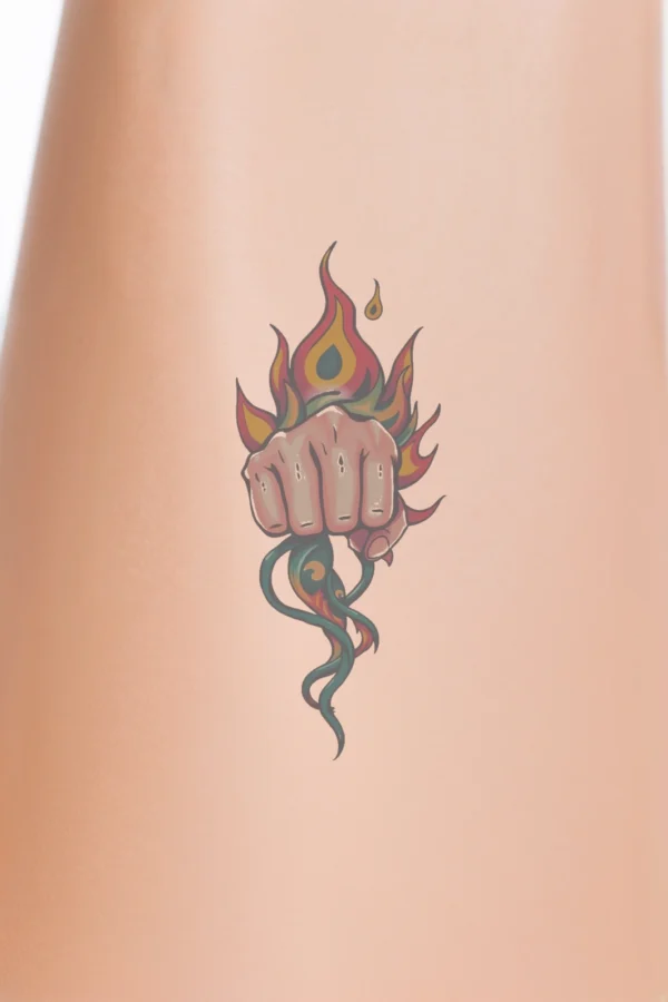 A vibrant temporary temporary tattoo design featuring a stylized fist in red, orange, and yellow, positioned centrally against a white background. The fist, depicted with extended fingers and defined knuckles, displays intricate flames and tendrils that intertwine around it,