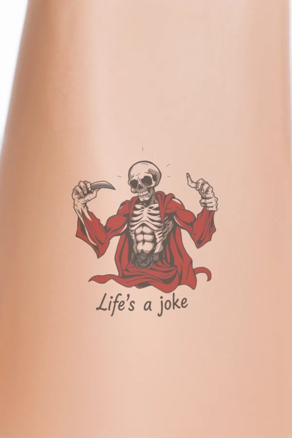 A temporary temporary tattoo design featuring a pale skeletal figure in a dramatic pose, wearing a flowing red cape and a black belt. The figure stands against a plain white background, with clenched fists and a head slightly tilted to the left, conveying strength and determination