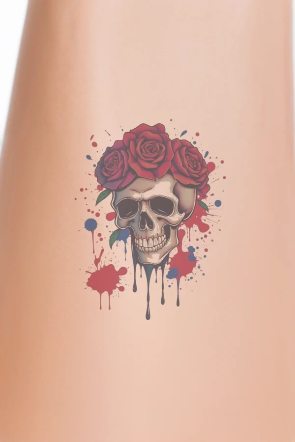 A detailed illustration of a skull adorned with a crown of three vibrant red roses. The skull is centered and facing right, with closed eyes and a slightly open mouth, conveying a serene expression. Rendered in shades of white and black, the skull contrasts