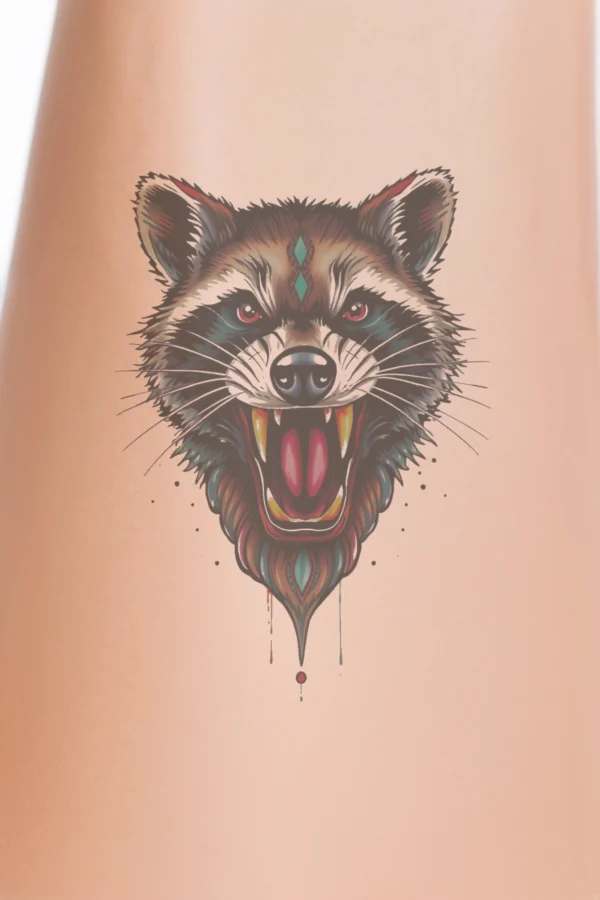 A temporary temporary tattoo design featuring a raccoon's face, illustrated in a style inspired by traditional Indian art. The raccoon has its mouth wide open in a fierce roar, showcasing sharp teeth and a prominent snout. Its fur is a blend of brown