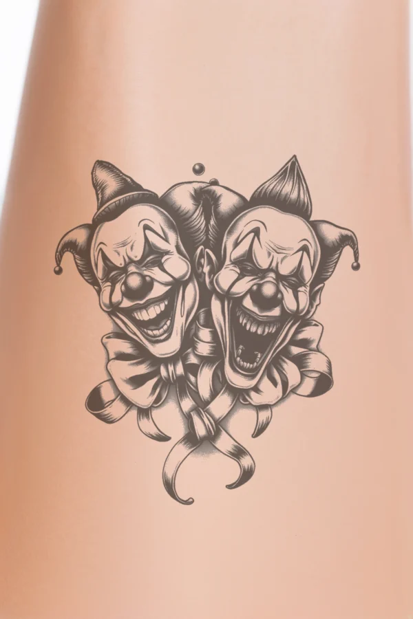Temporary temporary tattoo design featuring two cartoonish clown faces in black and white. The left clown has a wide, toothy grin and large, expressive eyes, while the right clown displays a sinister look with an open mouth. Both clowns wear brightly colored bow