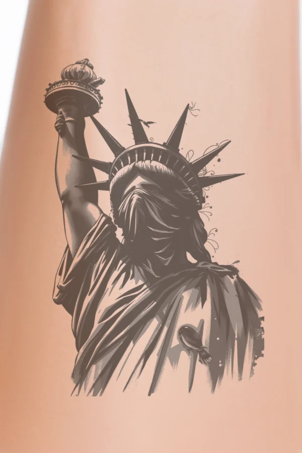 Temporary temporary tattoo design featuring the Statue of Liberty in bold black and white. The statue is depicted from a low angle, accentuating its grandeur. Its face is partially hidden by a dark mask, obscuring some facial features. The right arm is raised,