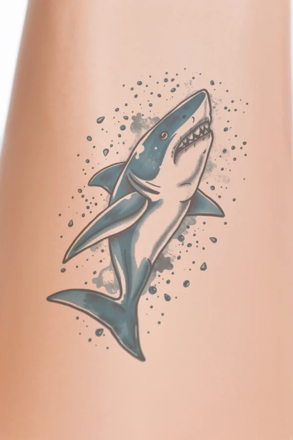 A temporary temporary tattoo design featuring a dynamic blue and white shark facing right, with its mouth open to reveal sharp teeth. The shark's body is primarily white with blue accents, and its tail is a darker shade of blue. Detailed fins and a streamlined form