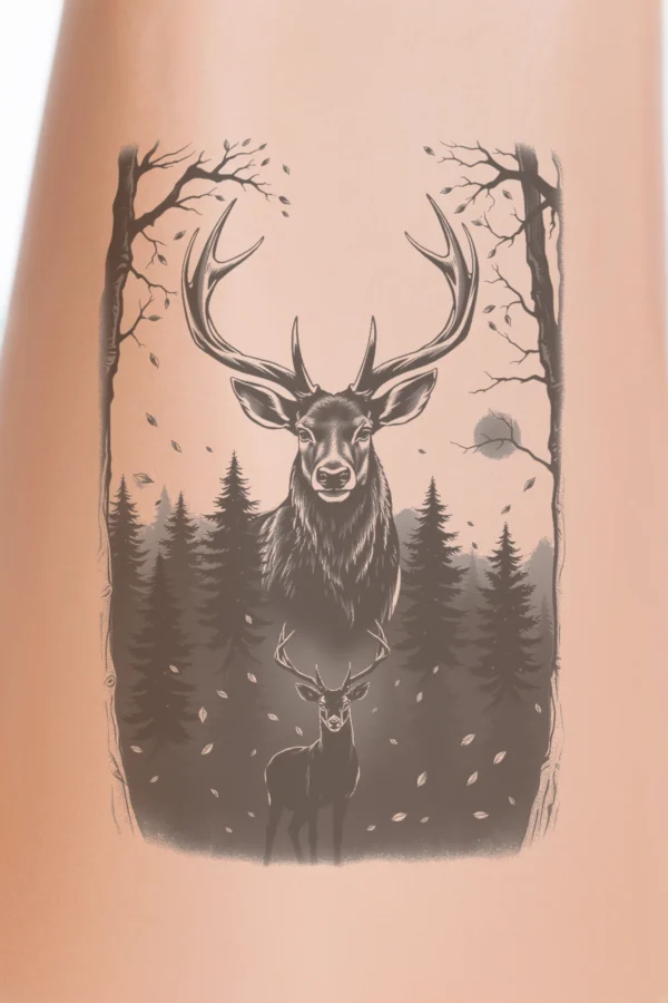 Temporary temporary tattoo design featuring a majestic dark gray stag with large antlers, positioned slightly off-center in a black and white forest setting. The stag stands tall with its head turned to the left, gazing directly at the viewer. Surrounding trees and foliage
