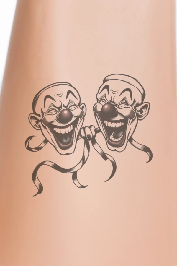 Temporary temporary tattoo design featuring two cartoon clown faces with exaggerated features. The clown on the left has a wide, open-mouthed smile and a dark nose, adorned with a dark ribbon around its neck. The clown on the right displays a closed-mouth smile