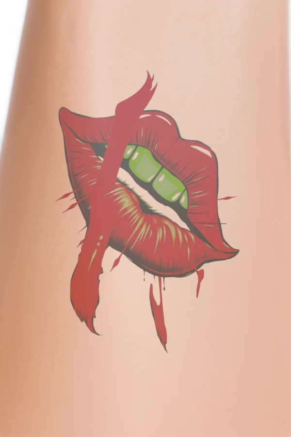 "Temporary temporary tattoo illustration of vibrant red lips, slightly parted to reveal a green substance inside, resembling lip gloss or lipstick. The lips feature a jagged red design with drips that evoke a stylized mouth or claw, blending lighter and darker shades of