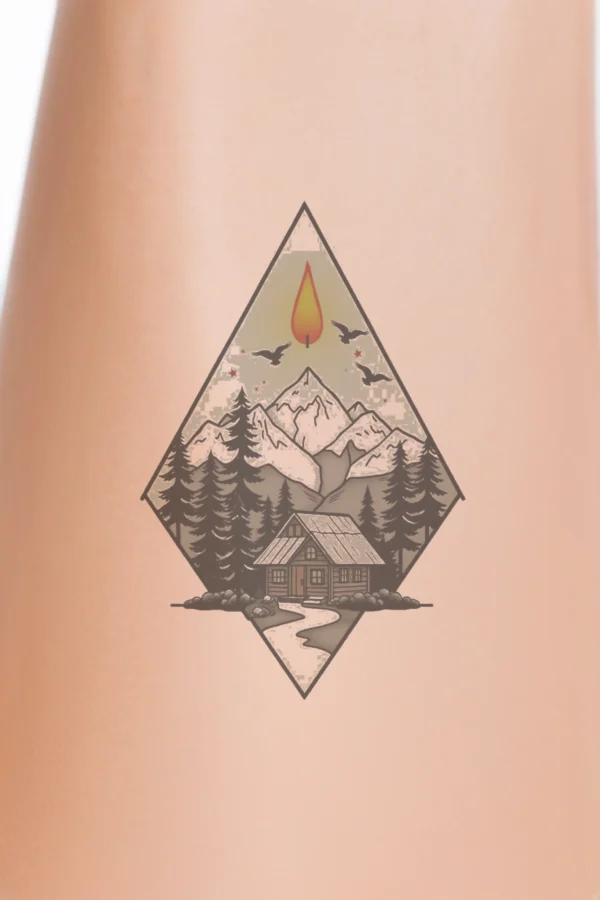 Temporary temporary tattoo illustration featuring a stylized mountain range with a prominent red/orange peak, surrounded by gray and white mountains in varying shades. The design is framed in a diamond shape, topped with a red/orange flame enclosed by a dark gray/black