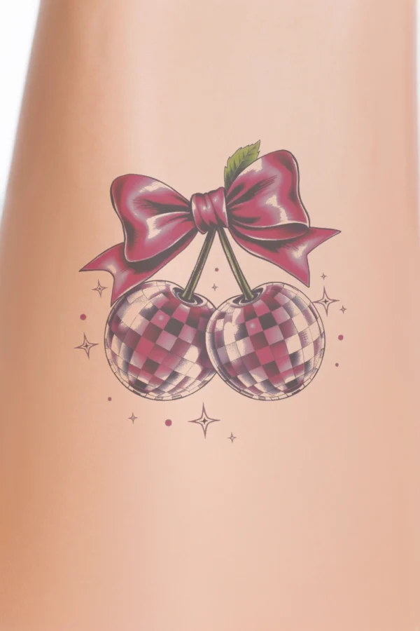 A vibrant temporary temporary tattoo design featuring two cherries, each decorated with a pink bow. The cherries, styled with a checkered pattern, are positioned on opposite sides of the image against a stark white background. Surrounding the cherries are small, pink stars,