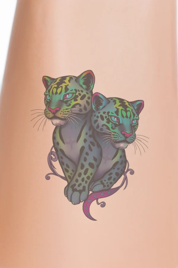 Illustration of two vibrant leopards with blue eyes and pinkish-orange noses, adorned with black and white spots. The leopards, primarily in shades of blue, black, green, and purple, are positioned side by side, facing each
