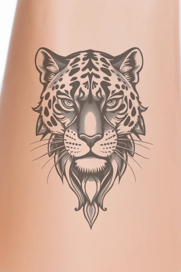 A detailed black and white temporary temporary tattoo design featuring the head of a leopard. The leopard's face, rendered in shades of gray, showcases its expressive eyes and prominent nose, while intricate markings and fur texture highlight its facial structure. The neutral expression and forward