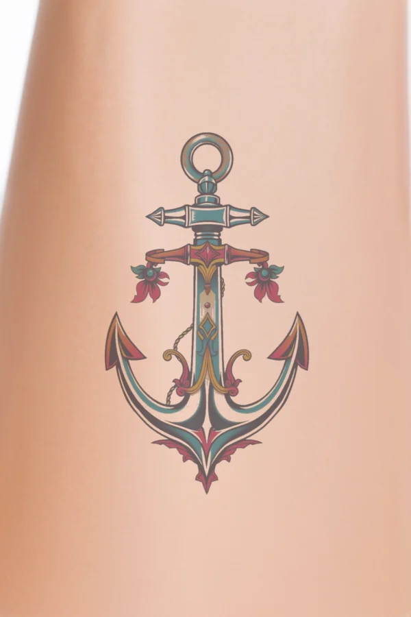 A vibrant temporary temporary tattoo featuring a central anchor illustration that symbolizes strength and stability. The anchor is predominantly blue and white, with a dark blue/black top and a lighter blue/white bottom. Adorning the anchor are a red and pink flower on the